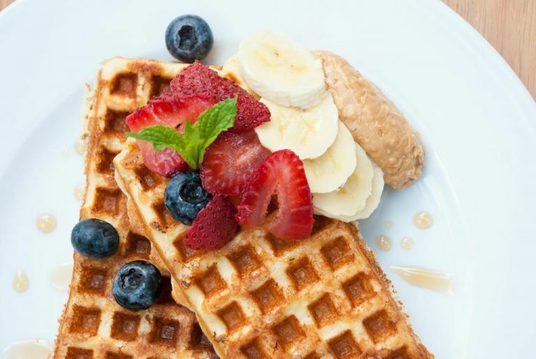 Oat flour waffle with berries and almond butter